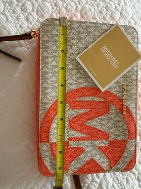 Michael Kors Cream and Orange Logo-Print Wristlet Clutch